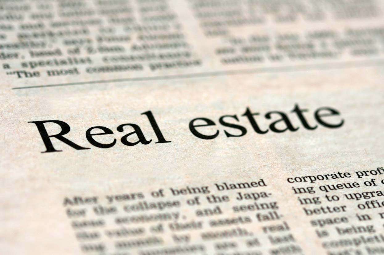 Real estate headline in newspaper, emphasizing industry terminology for SEO enhancement in marketing content.